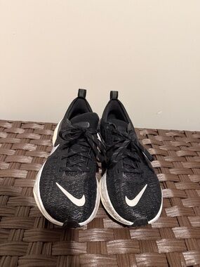Nike Black Running Shoes with White Midsole and Red Heel Accent